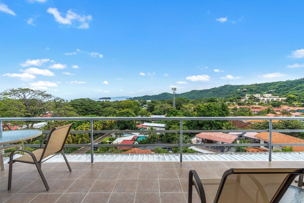 Modern Top-Floor Condo with Panoramic Views and Community Pool