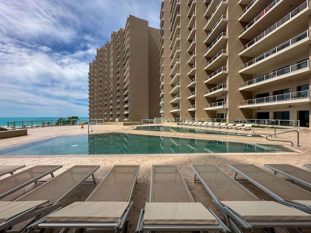 Brand-new Modern 2BR Gem on Iconic Sandy Beach