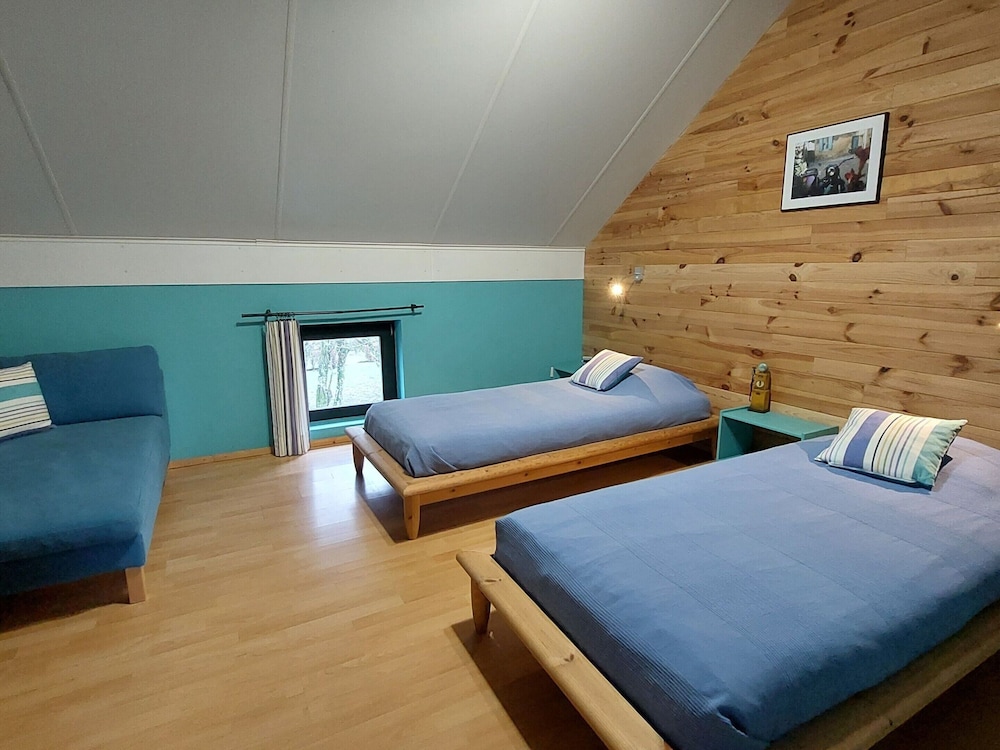 Rustic Holiday Home with Sauna & Hot Tub in Wooded Area view 3