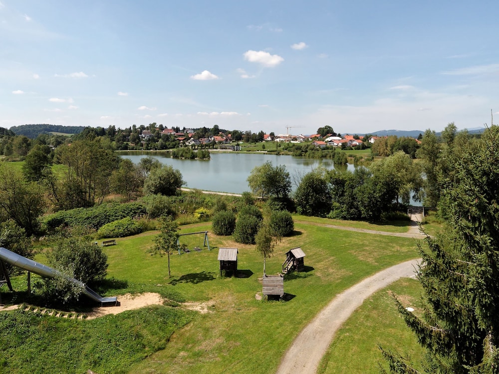 Wooden Chalet With Terrace Near a Swimming Lake