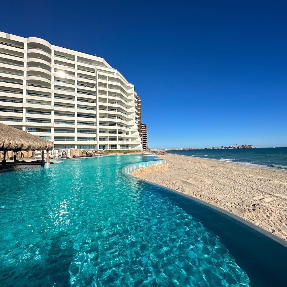 Brand-new Modern 2BR Gem on Iconic Sandy Beach