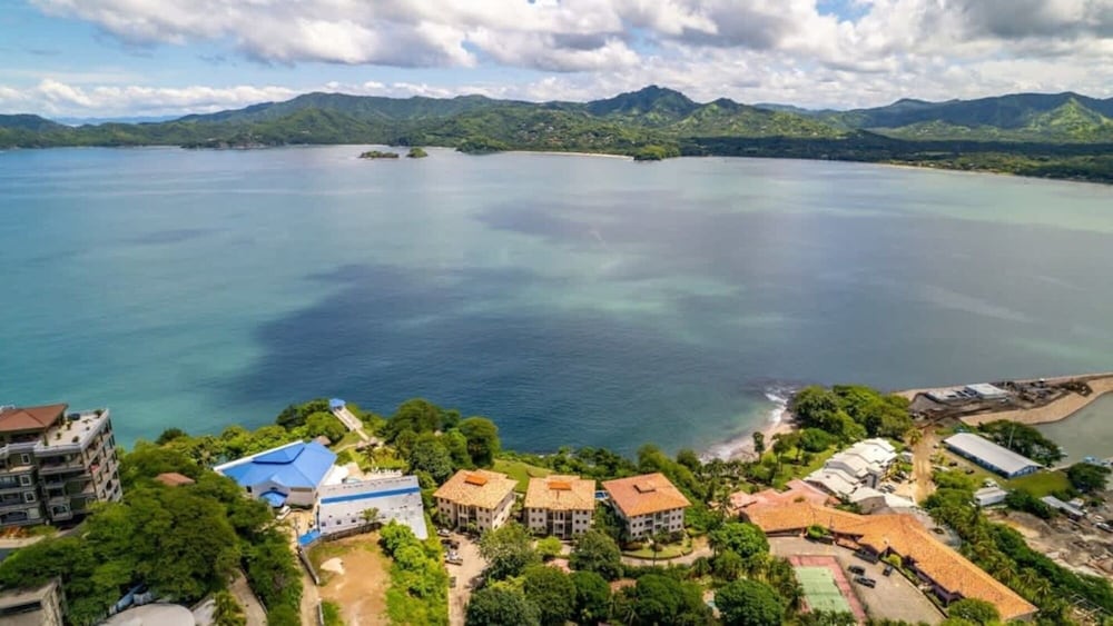 Elegant Condo with Brand-New Fixtures, Shaded Tropical Terrace, and Secluded Beach Access