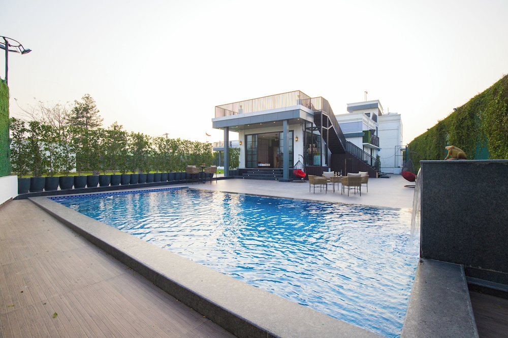 ELIVAAS Ibiza Luxe 4-BHK Farmhouse
