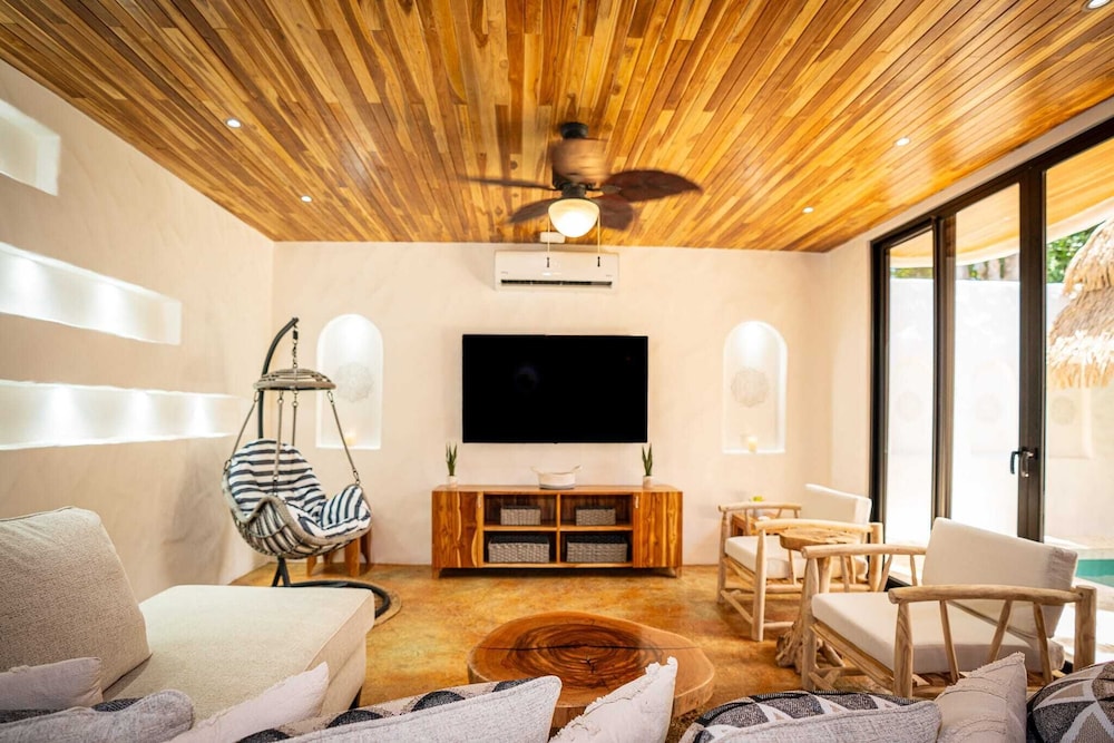 Bohemian Tropical Villa with a Tiki-Style Swimming Pool & Swim-Up Bar with an Attached Studio Apartment