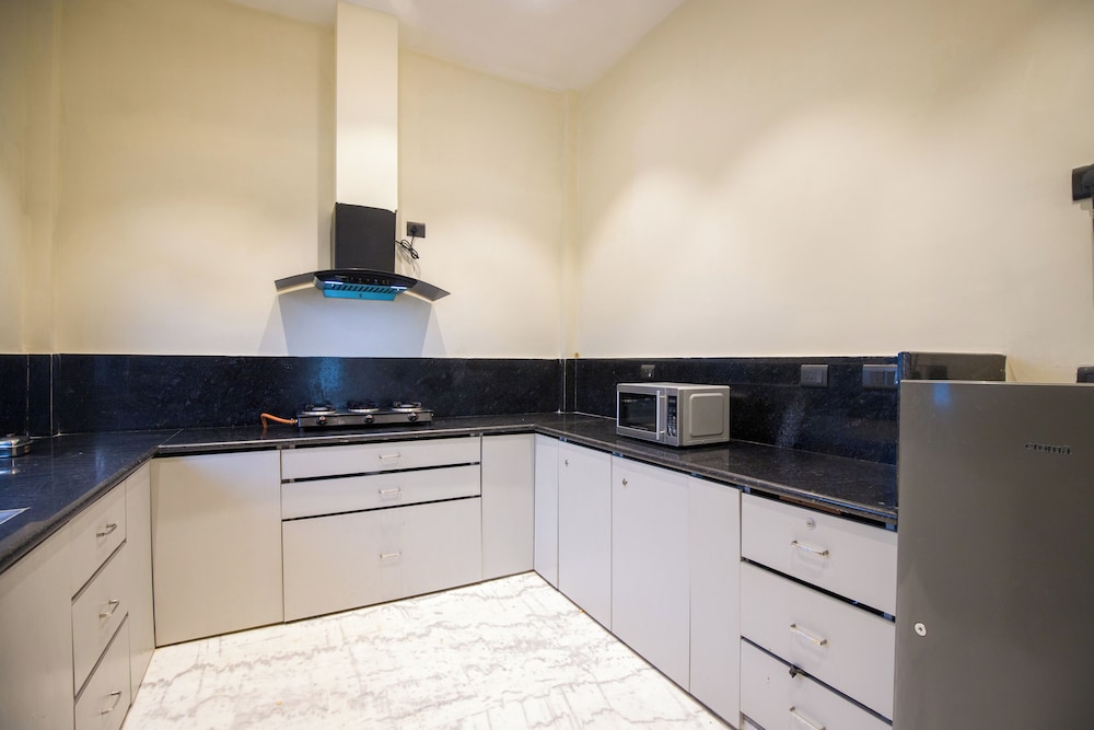 ELIVAAS Ibiza Luxe 4-BHK Farmhouse