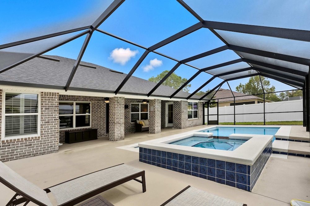 Modern 4BR Retreat Near Beach Heated Pool