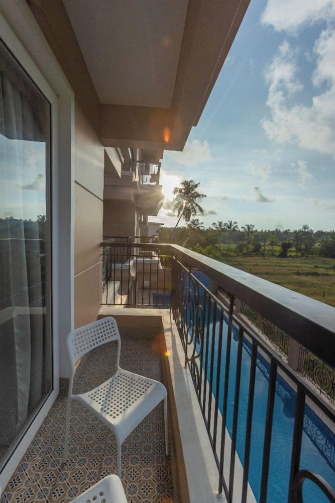 Palm Retreat 1BHK Pool & Field Views