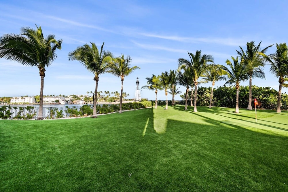 Luxurious 3-story Estate With Gym Pool Slide Private Beach and Lighthouse Views