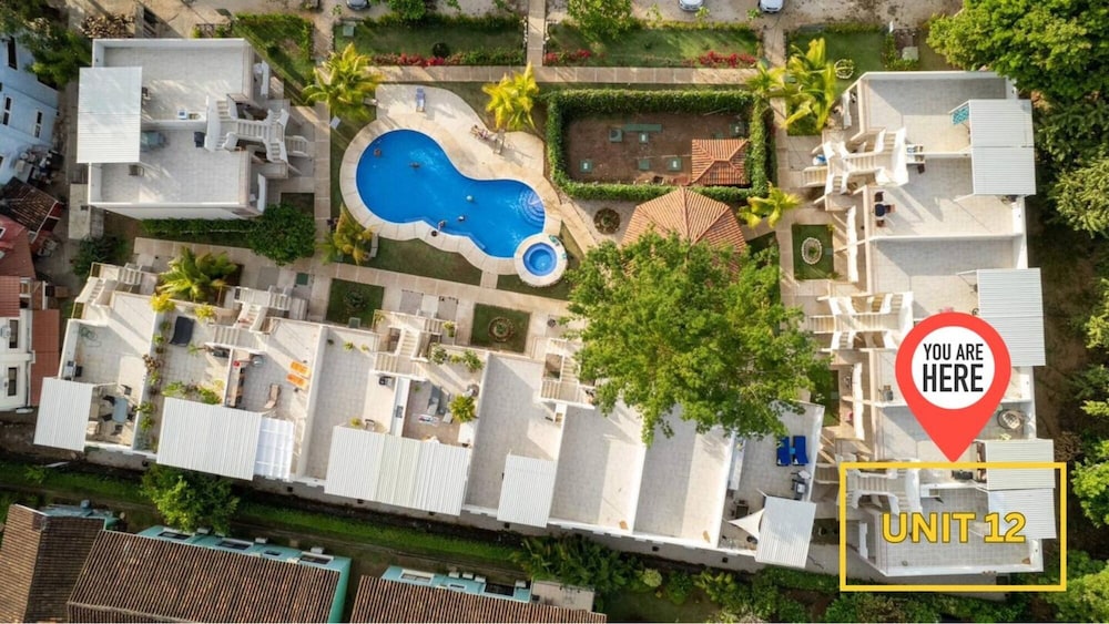 Cozy Condo with Panoramic Hillside Views from Rooftop Terrace and Short Walk to Beach