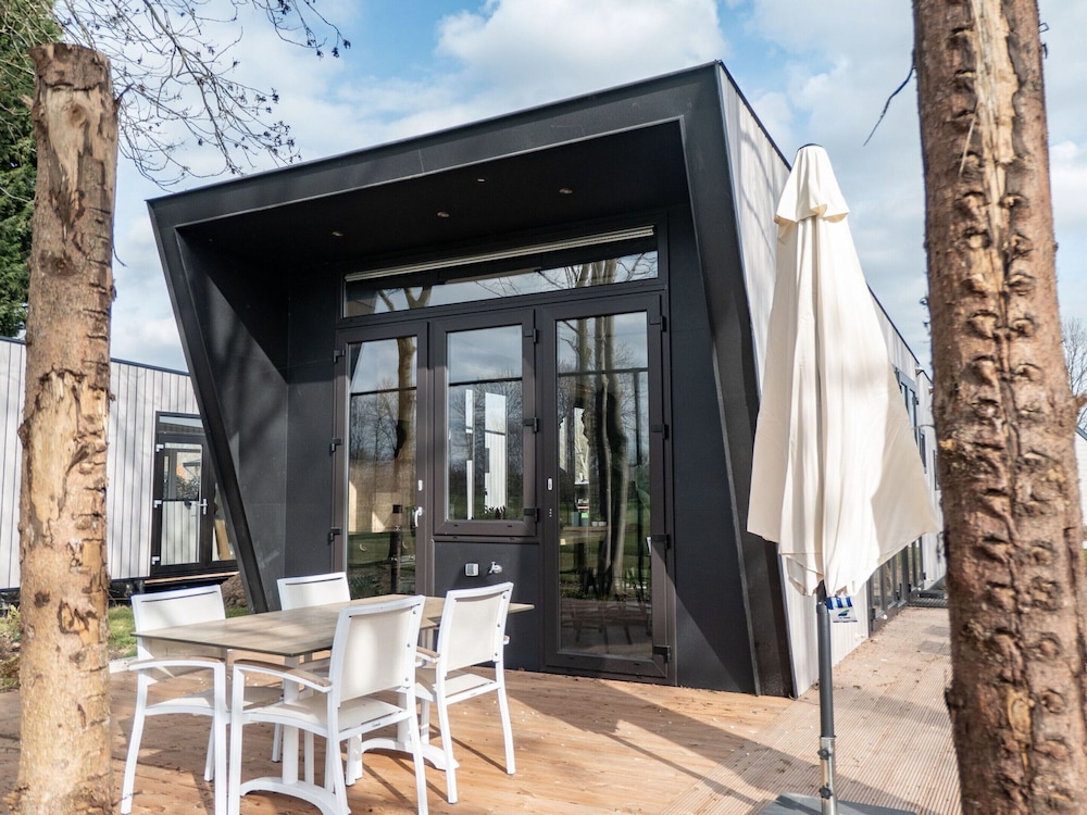 Modern Chalet by the River Maas