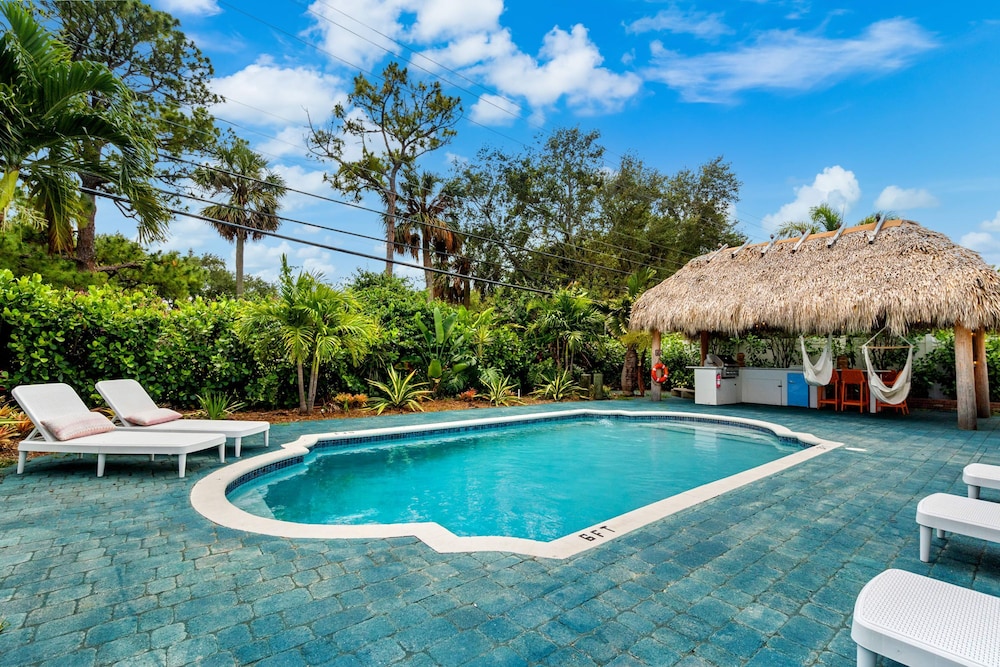 Eccentric Home With Pool Tiki hut Outdoor Kitchen