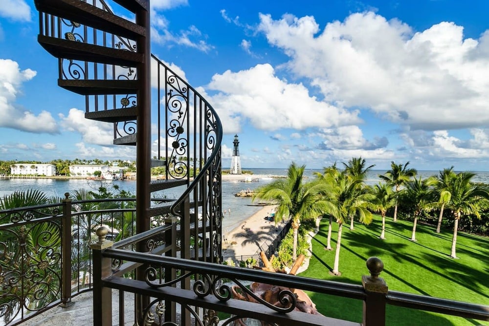 Luxurious 3-story Estate With Gym Pool Slide Private Beach and Lighthouse Views