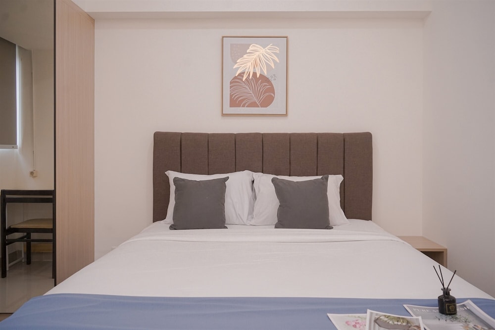 Minimalist And Warm Studio Room At Cisauk Point Apartment