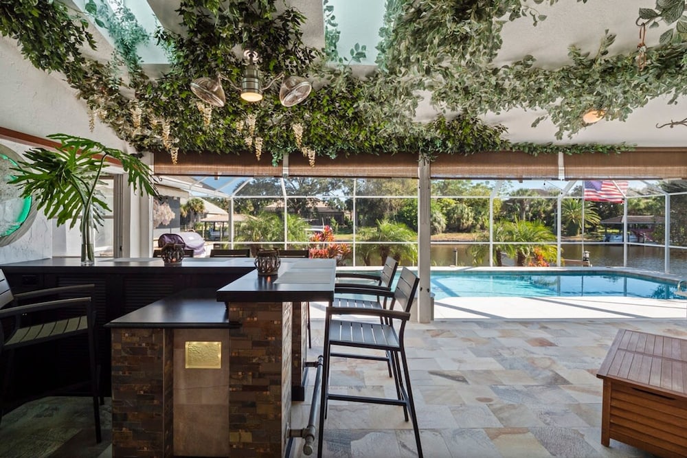 Luxury Heated Pool Home on Saltwater Canal w Tiki