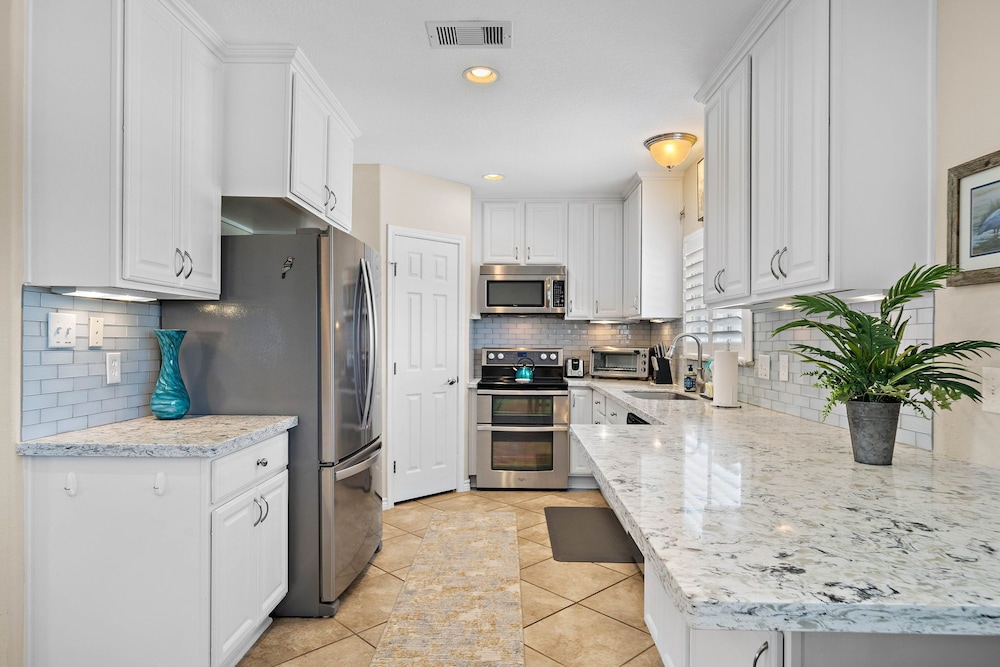 Purple Pelican Paradise by Ryson Vacation Rentals