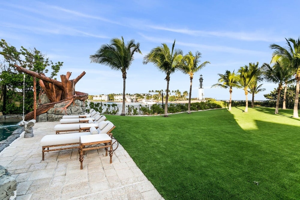 Luxurious 3-story Estate With Gym Pool Slide Private Beach and Lighthouse Views