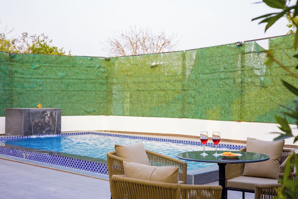 ELIVAAS Ibiza Luxe 4-BHK Farmhouse