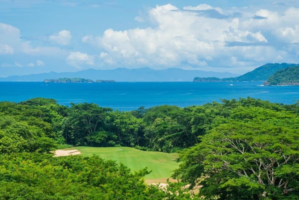 Stunning Luxury Penthouse in Exclusive Beachfront Community with Resort-Style Amenities & Sweeping Views of the Ocean & Golf Course