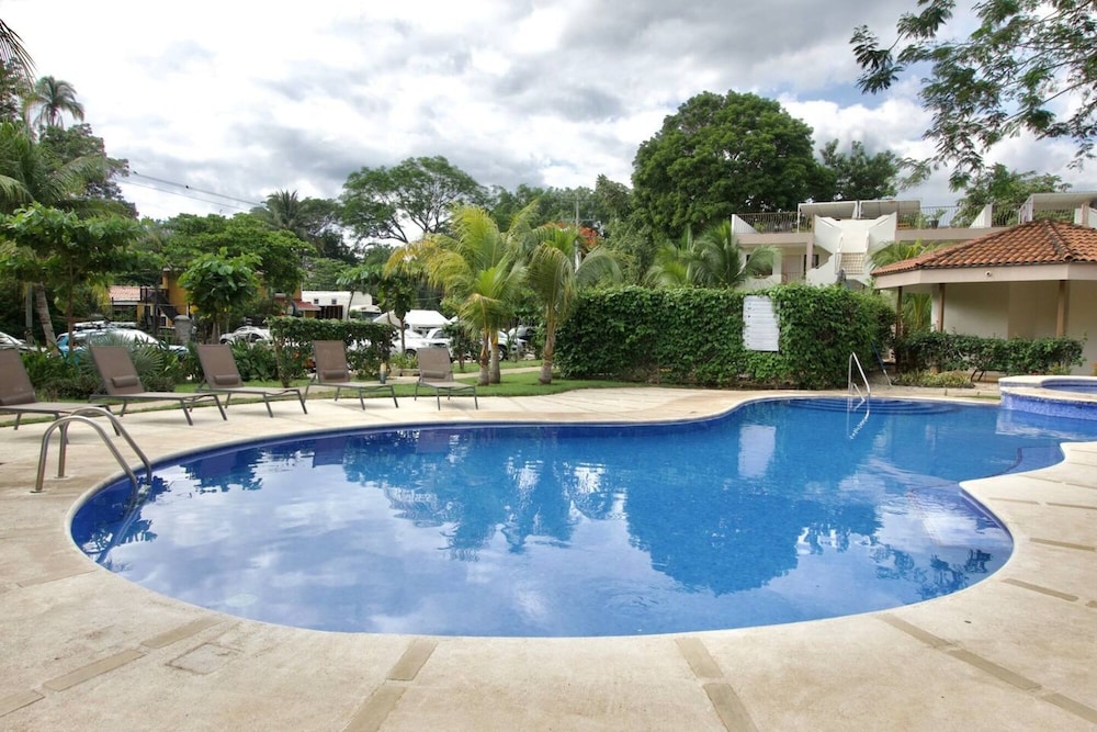 Cozy Condo with Panoramic Hillside Views from Rooftop Terrace and Short Walk to Beach