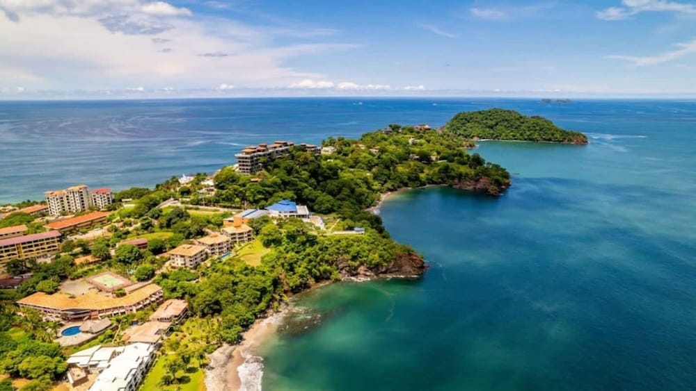 Elegant Condo with Brand-New Fixtures, Shaded Tropical Terrace, and Secluded Beach Access