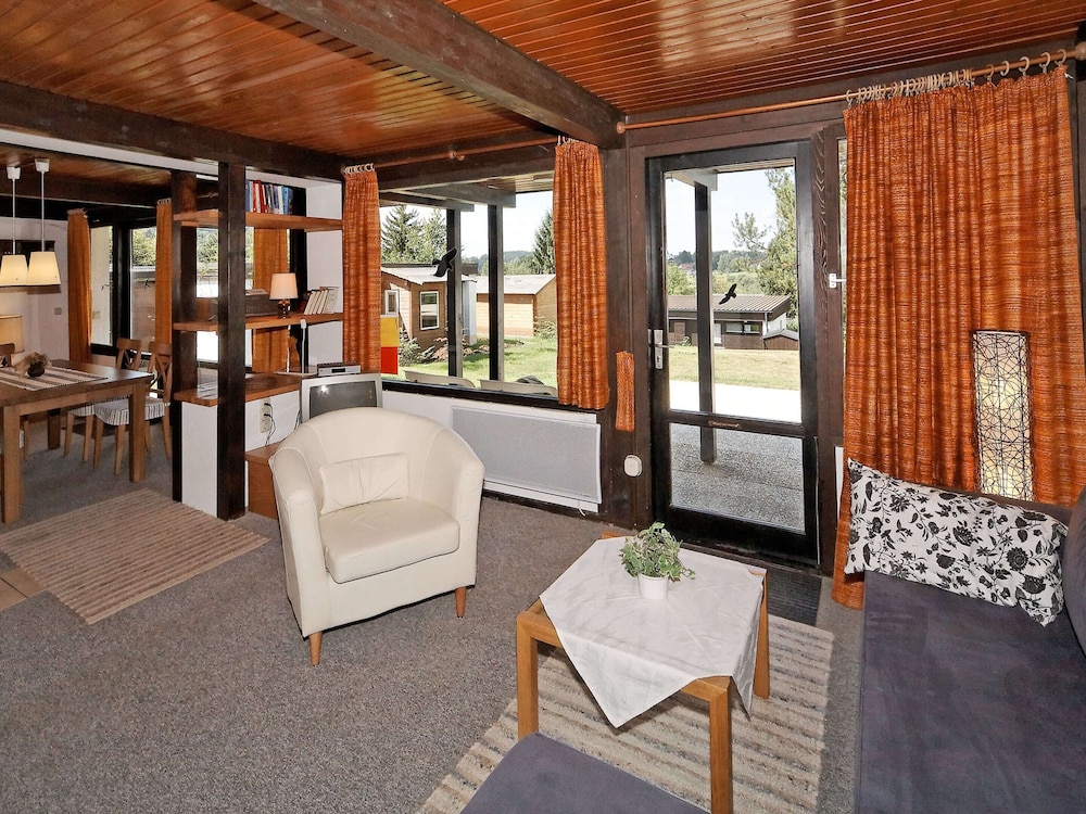 Detached Chalet with Terrace near Swimming Lake view 2