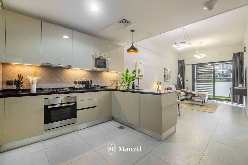 Manzil-Stylish 1BR with Maid room in JVC