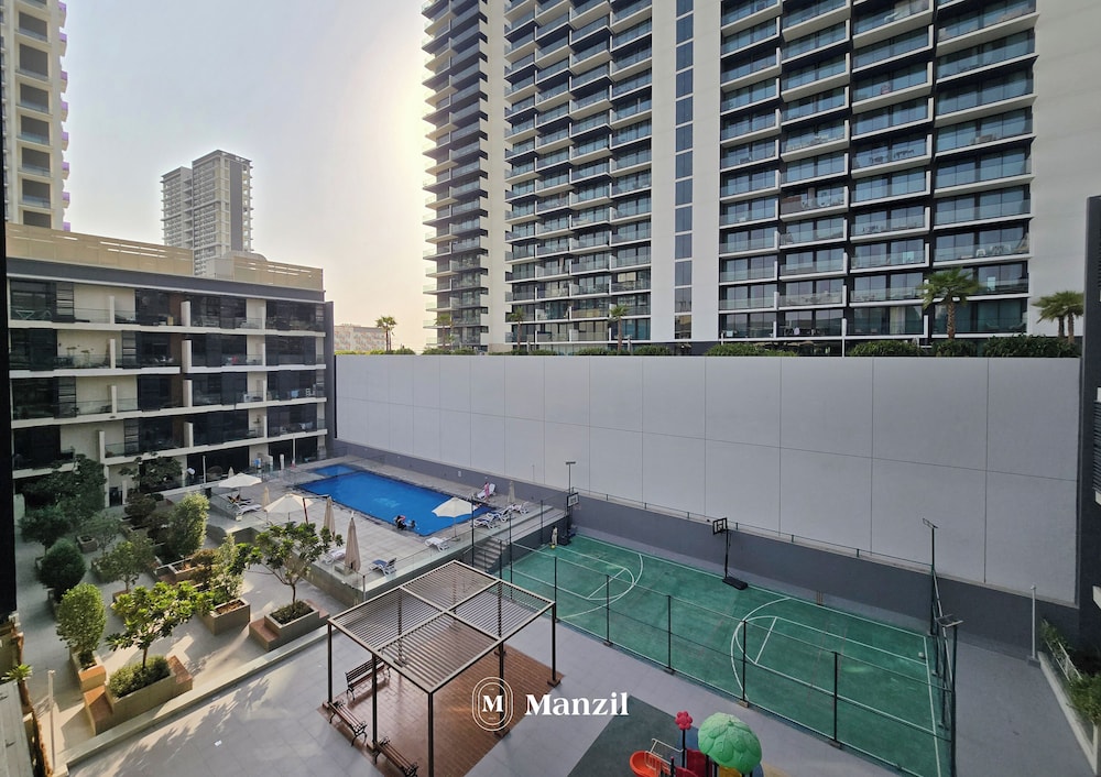 Manzil-Stylish 1BR with Maid room in JVC