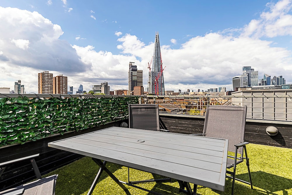 Modern Haven With Terrace View & Urban Charm