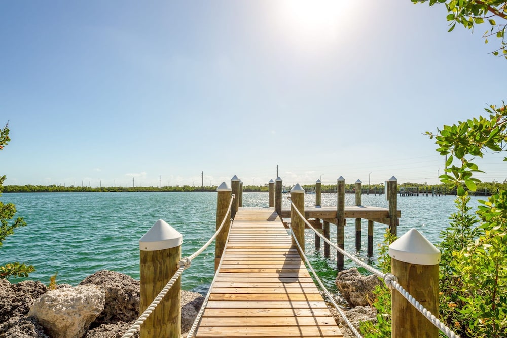 Suncoast House by Brightwild Pool Boat Dock view 3