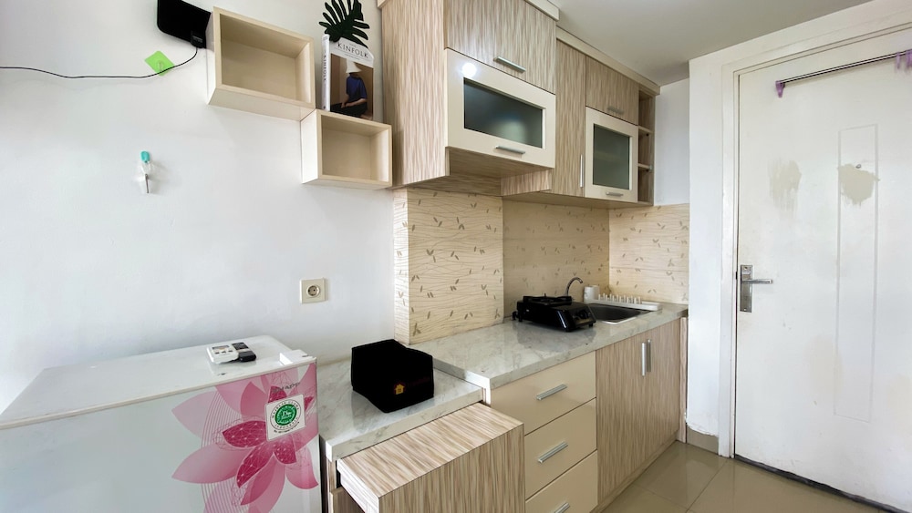Homey And Cozy Living Studio At Poris 88 Apartment