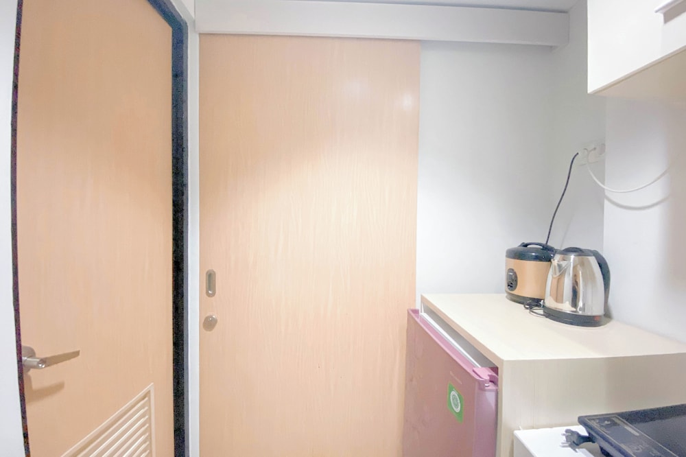 Simple White Studio Apartment At The Alton Semarang