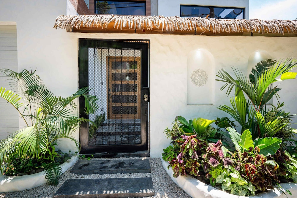 Bohemian Tropical Villa with a Tiki-Style Swimming Pool & Swim-Up Bar with an Attached Studio Apartment