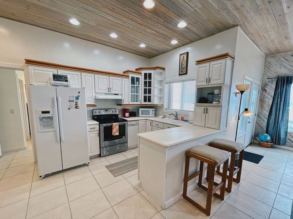 Ocean Front Beach Walking Distance To Flagler 4 Bedroom Home by RedAwning