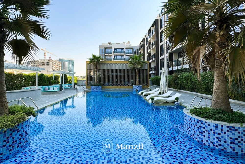 Stylish 1BR Apt w Pool in JVC nr Dubai Sports City