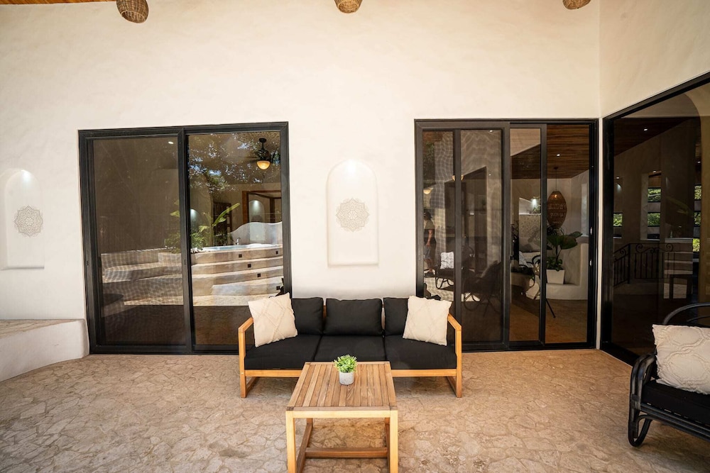 Bohemian Tropical Villa with a Tiki-Style Swimming Pool & Swim-Up Bar with an Attached Studio Apartment