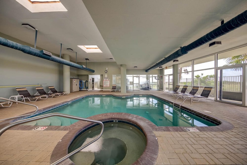 Delightful Beachfront Condo Indoor Outdoor Pool view 5