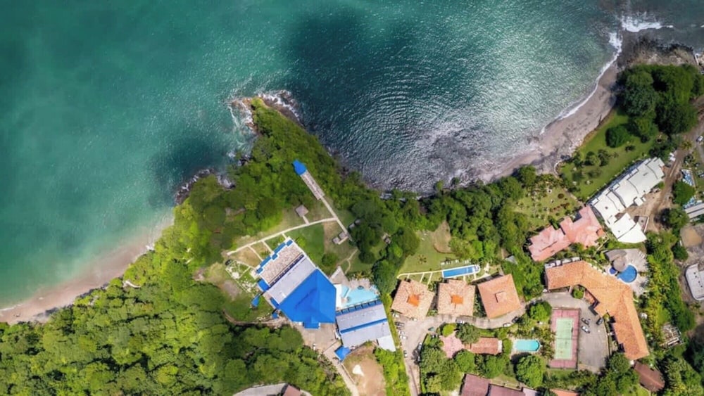Elegant Condo with Brand-New Fixtures, Shaded Tropical Terrace, and Secluded Beach Access