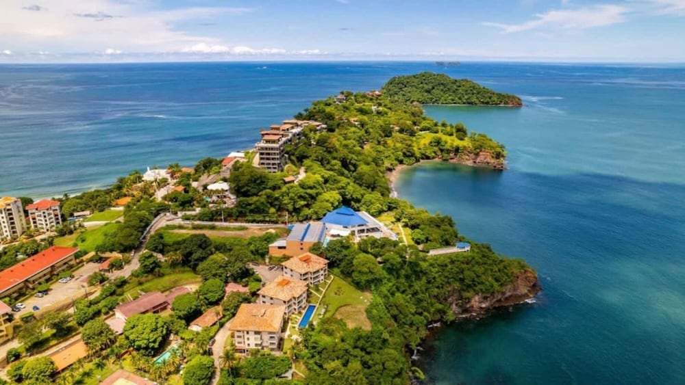 Elegant Condo with Brand-New Fixtures, Shaded Tropical Terrace, and Secluded Beach Access