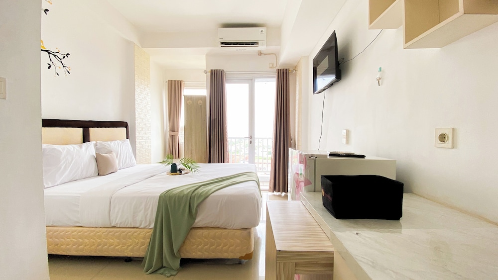 Homey And Cozy Living Studio At Poris 88 Apartment
