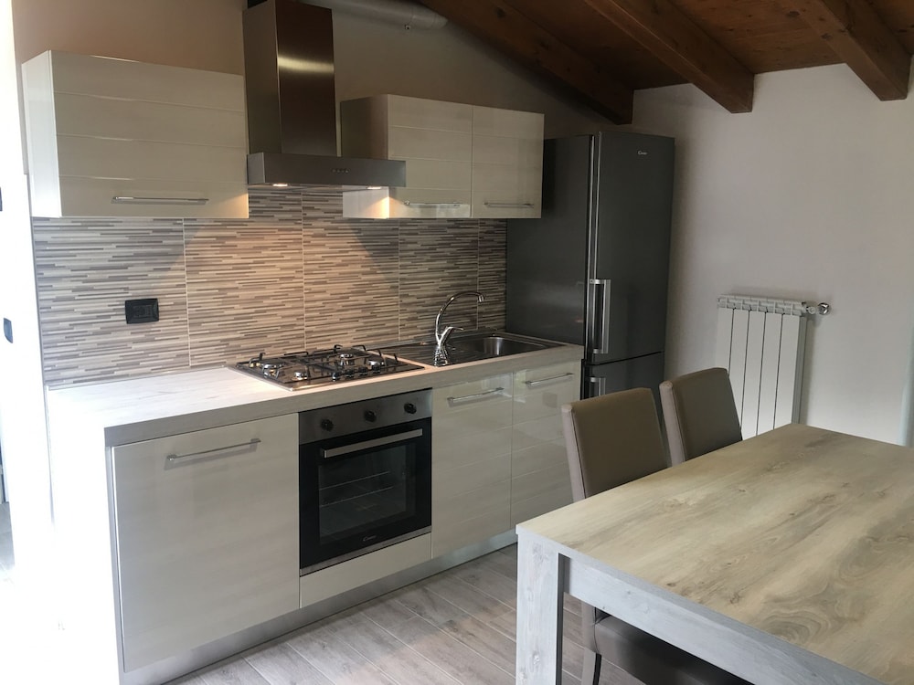 Attic with Pool en Nesso — kitchen
