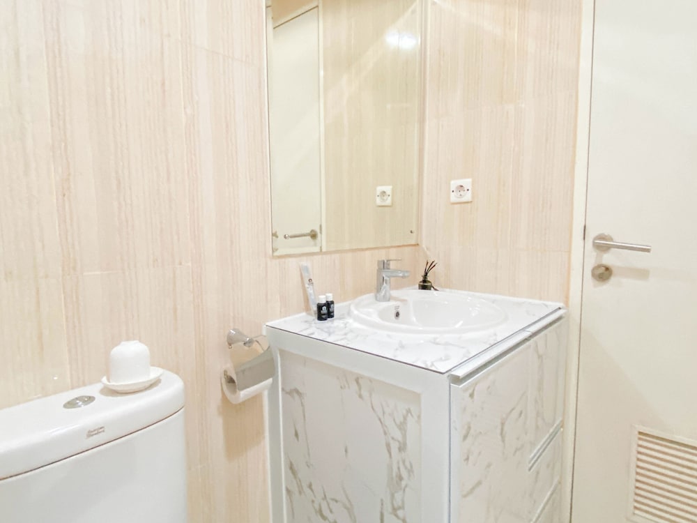 Warm and Cozy 1BR without Living Room at Sentul Tower Apartment