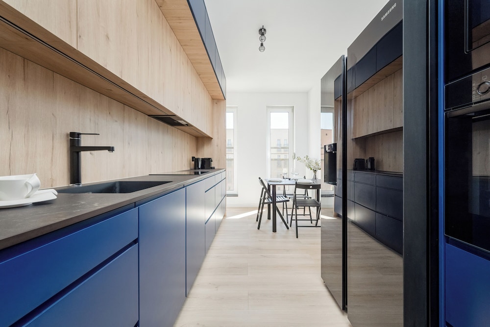 Wroclaw Dark Blue Apartment by Renters
