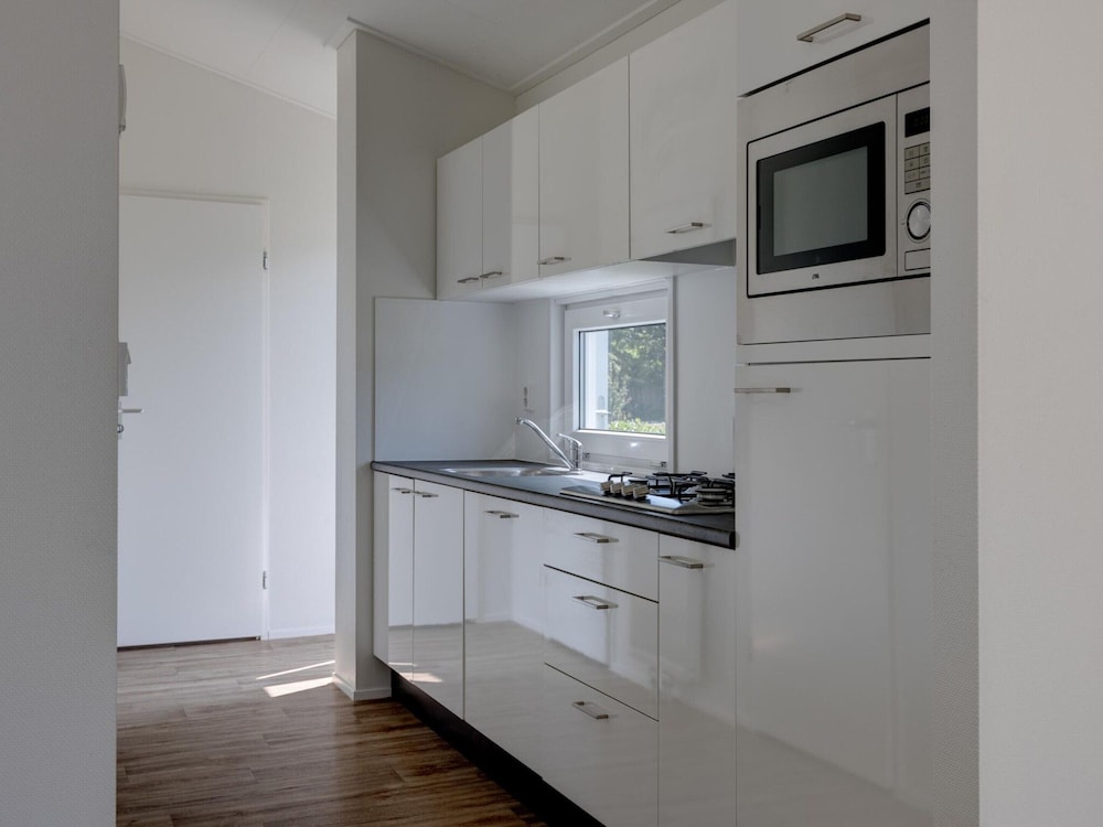 Beautiful Chalet With Airco, in a Holiday Park view 4