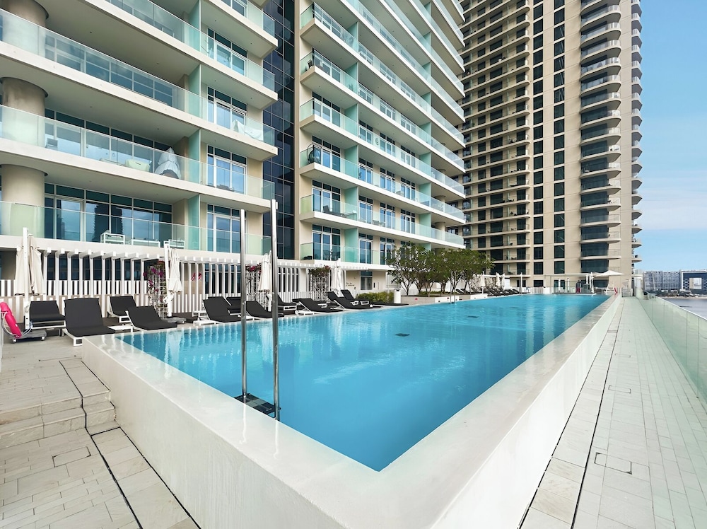 2BR Beachfront Retreat with Palm Views