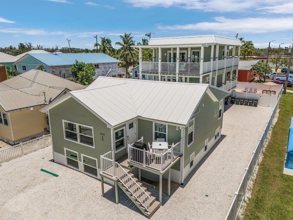 Coconut Sunsets A & B on Estero Blvd, 7 Bedroom Hom by RedAwning