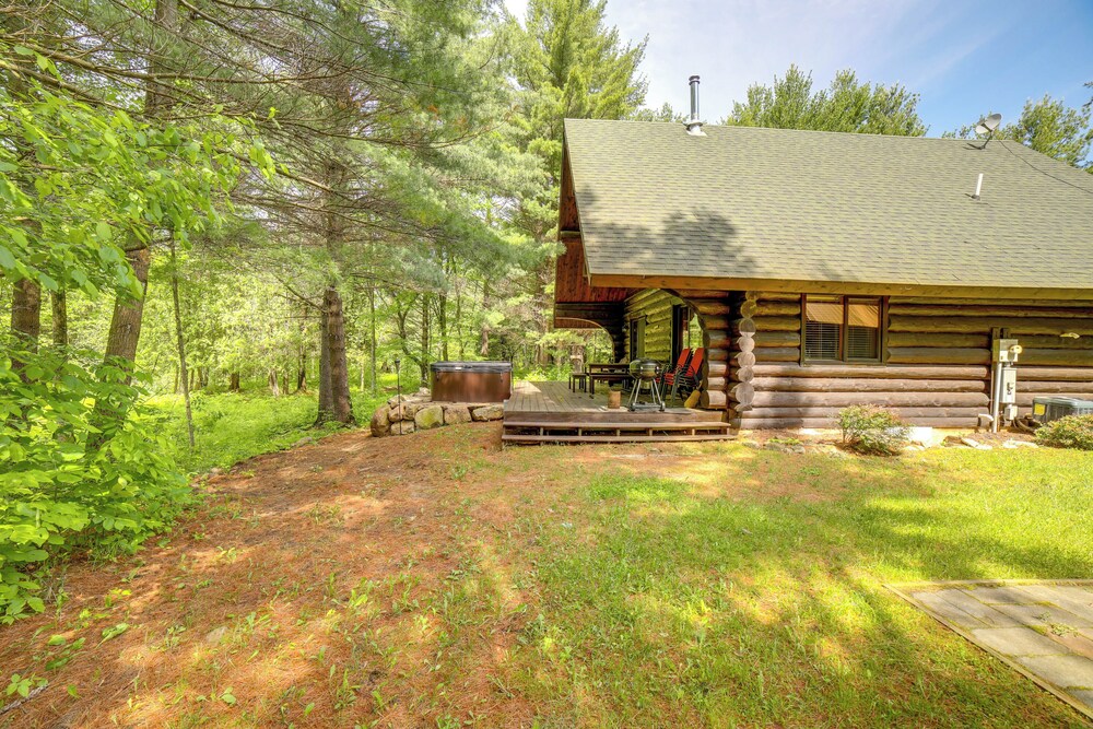 Secluded Log Cabin in NW Michigan: Hot Tub Deck - Property Image 9