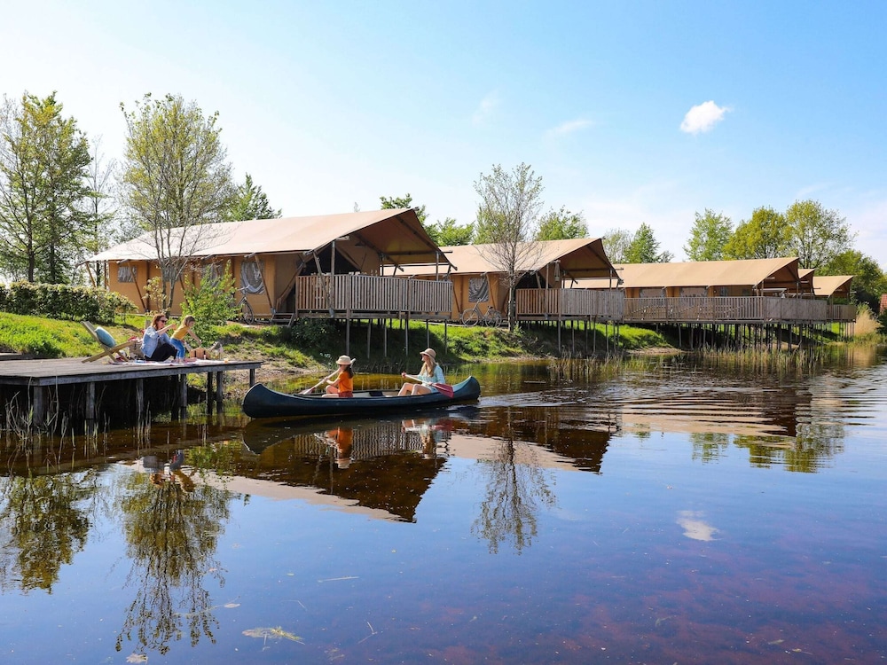Campsite - Combined Tents With Kitchen and Bathroom Located Near a Pond