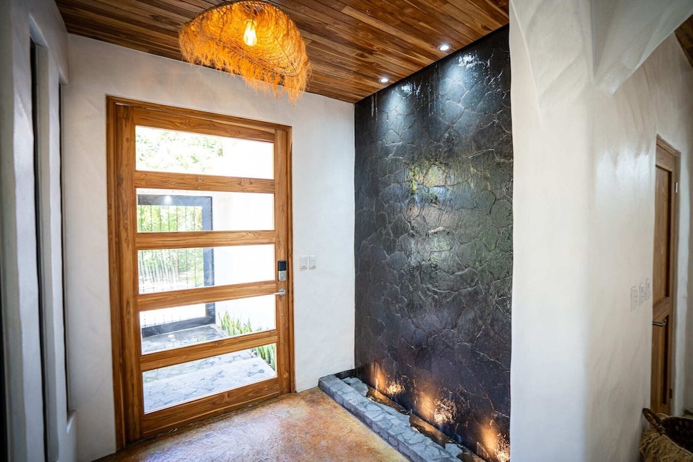 Bohemian Tropical Villa with a Tiki-Style Swimming Pool & Swim-Up Bar with an Attached Studio Apartment