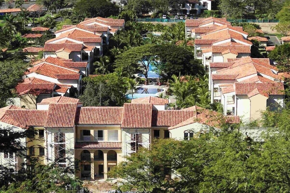 Ground-floor unit in front of lazy river pool at Pacifico in Coco