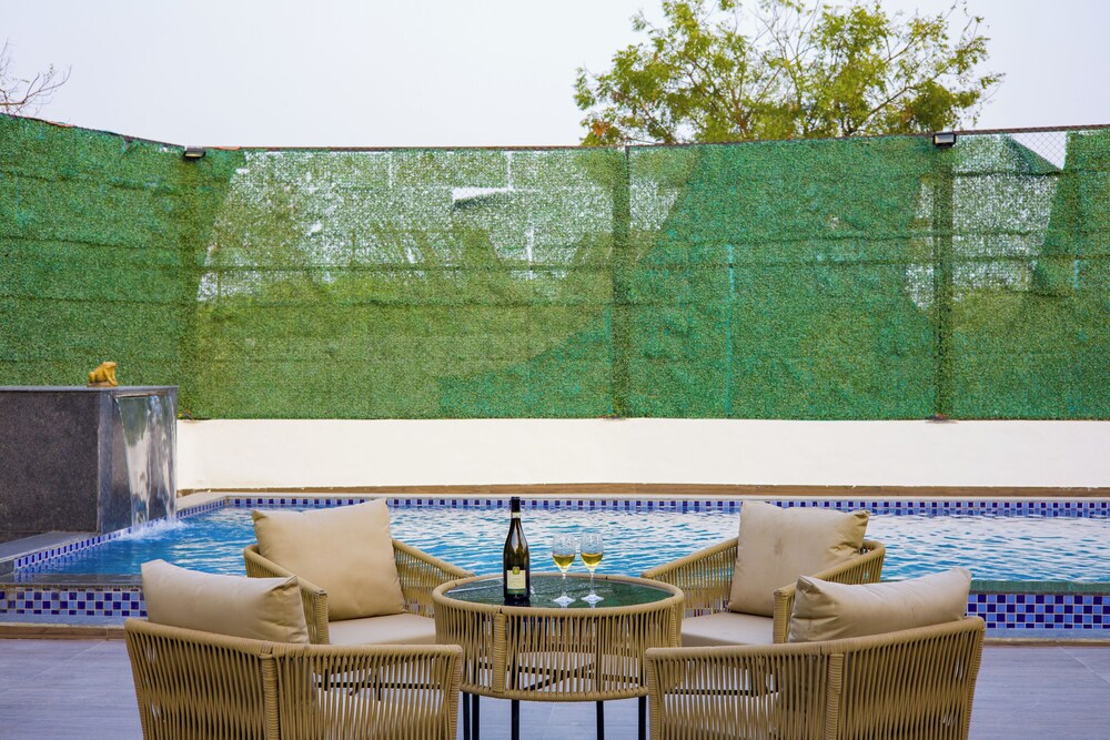 ELIVAAS Ibiza Luxe 4-BHK Farmhouse